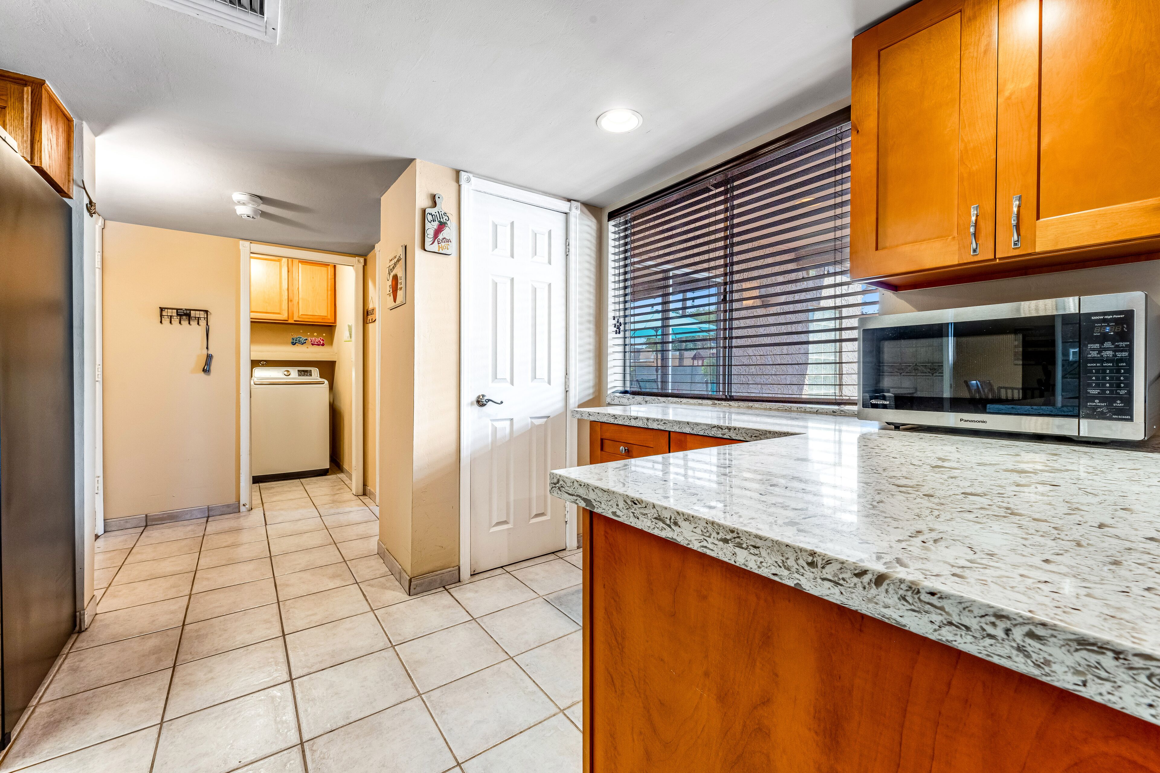 Quiet Scottsdale retreat with enclosed yard, pool, patio, grill, game room & W/D