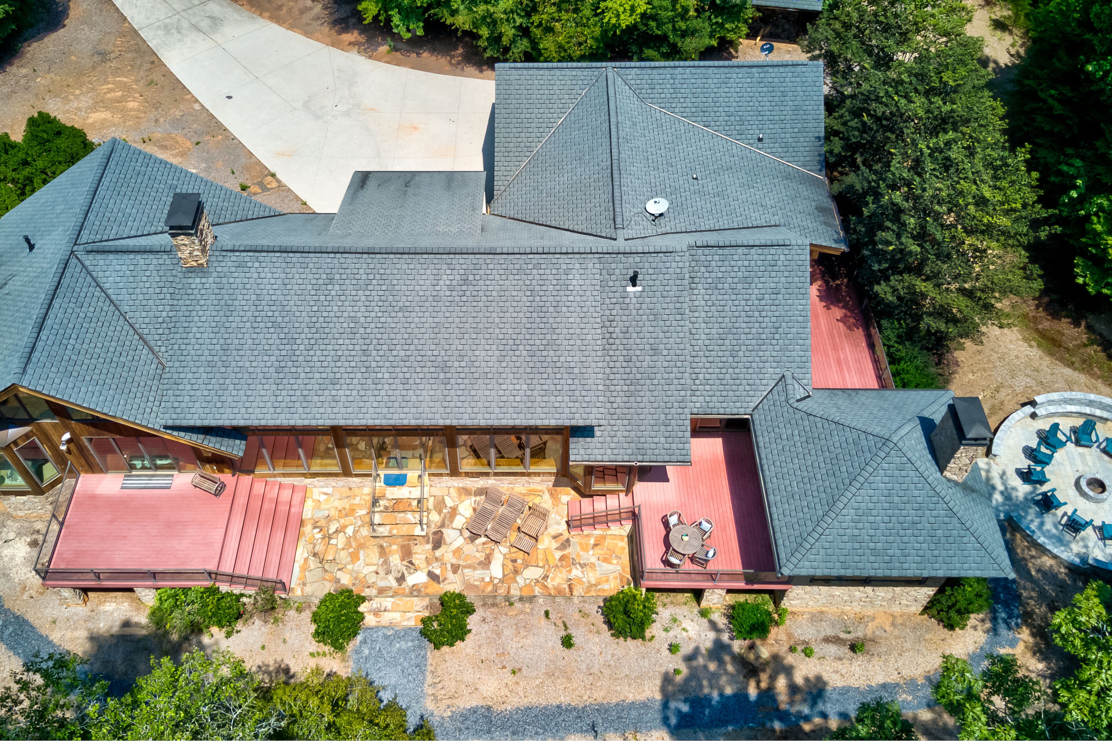 Custom riverfront retreat with private pond, dock, firepit & outdoor living