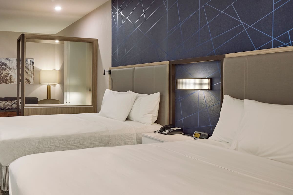 suite, multiple beds | 1 bedroom, individually decorated, individually furnished, desk