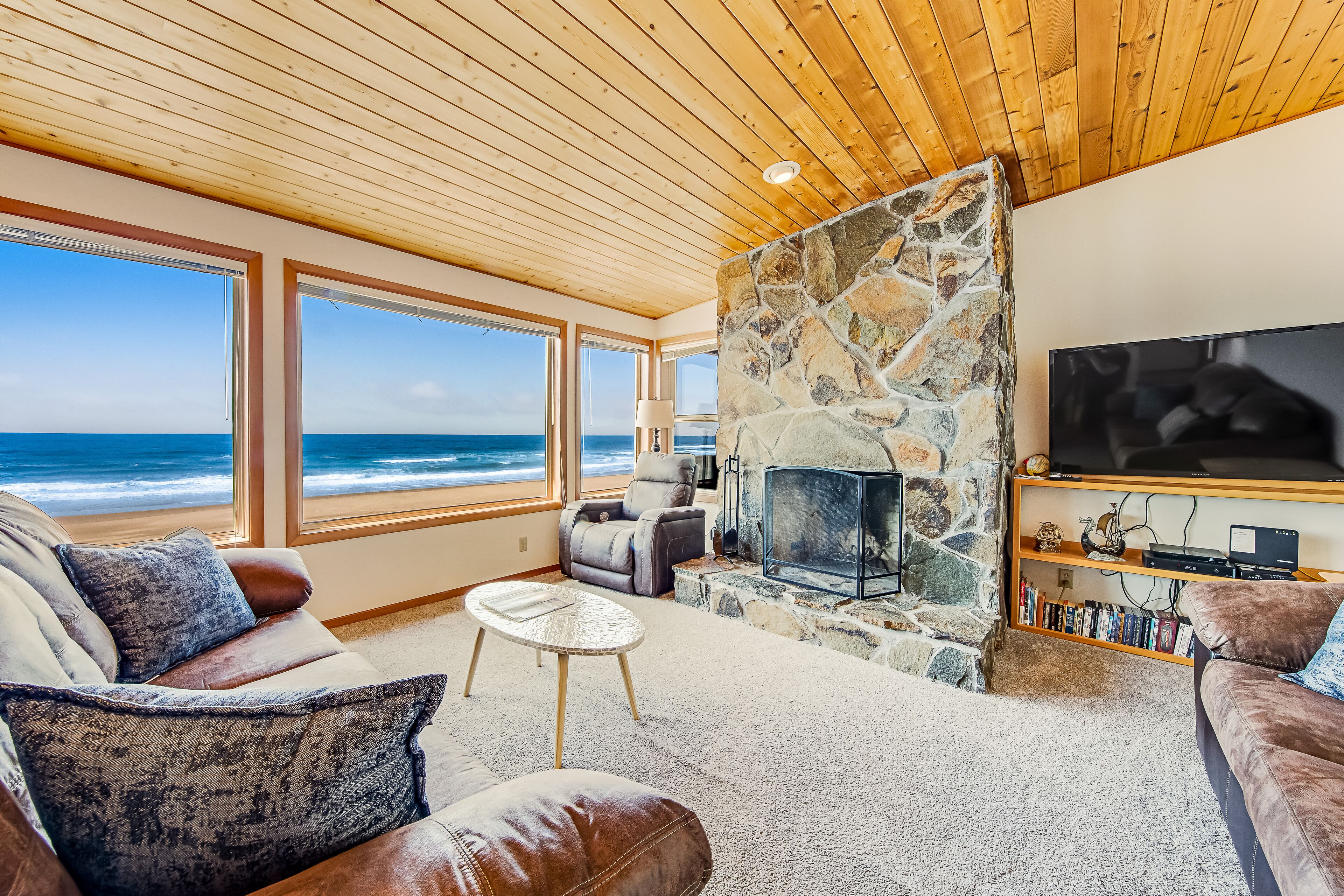 Two-story oceanfront retreat with a washer/dryer, firepit, & Ping-Pong table