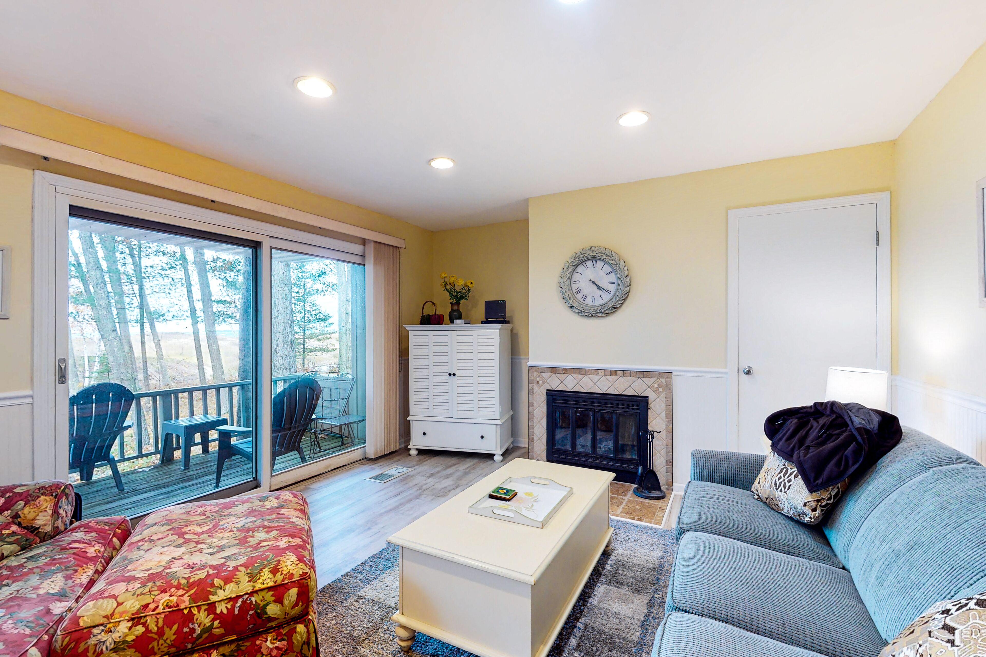 Riverfront condo with lake and river access, fireplace, firepit & gym