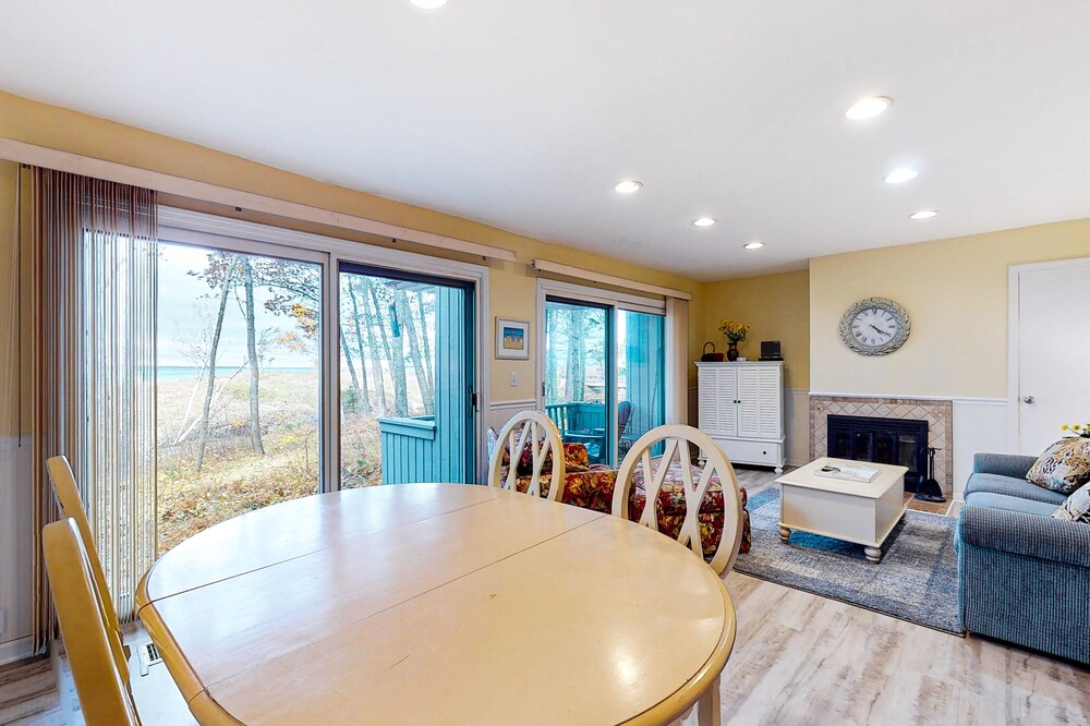 Riverfront condo with lake and river access, fireplace, firepit & gym
