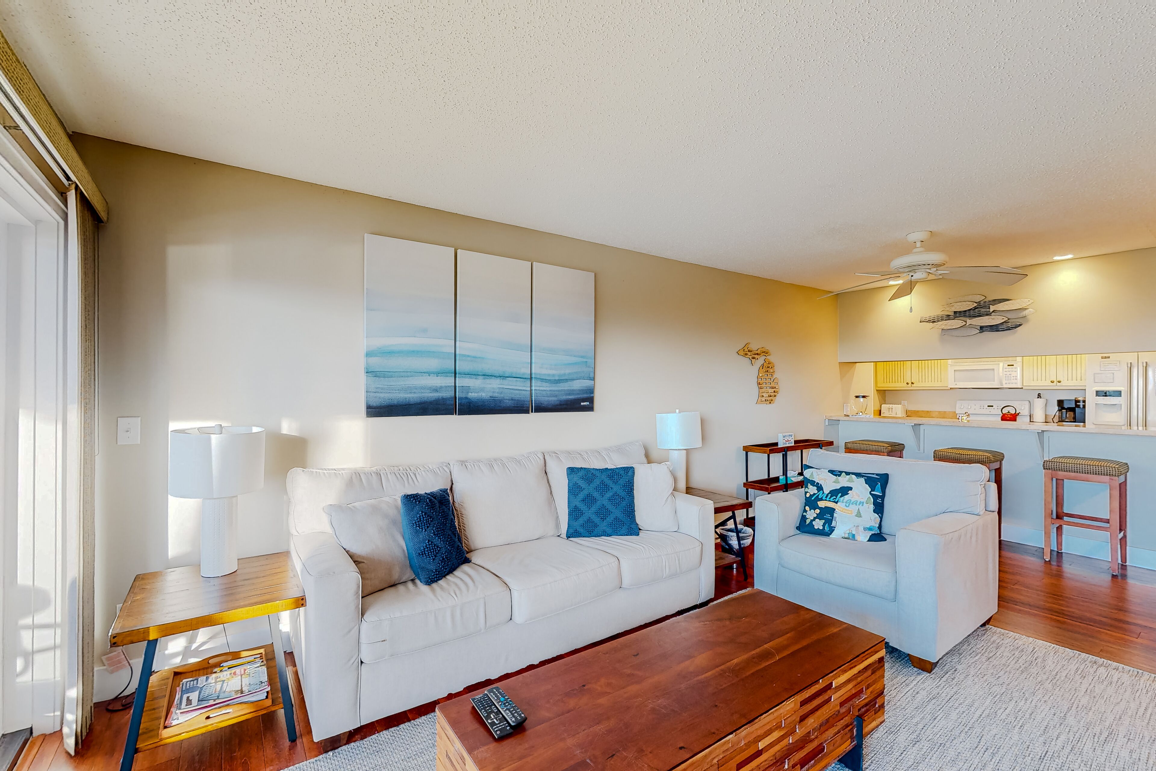 Lovely waterfront condo with lake access, fireplace, deck, river views, W/D