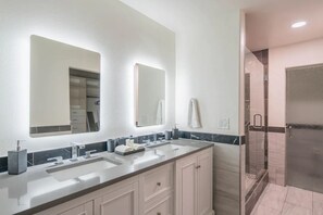 Combined shower/tub, hair dryer, towels, toilet paper