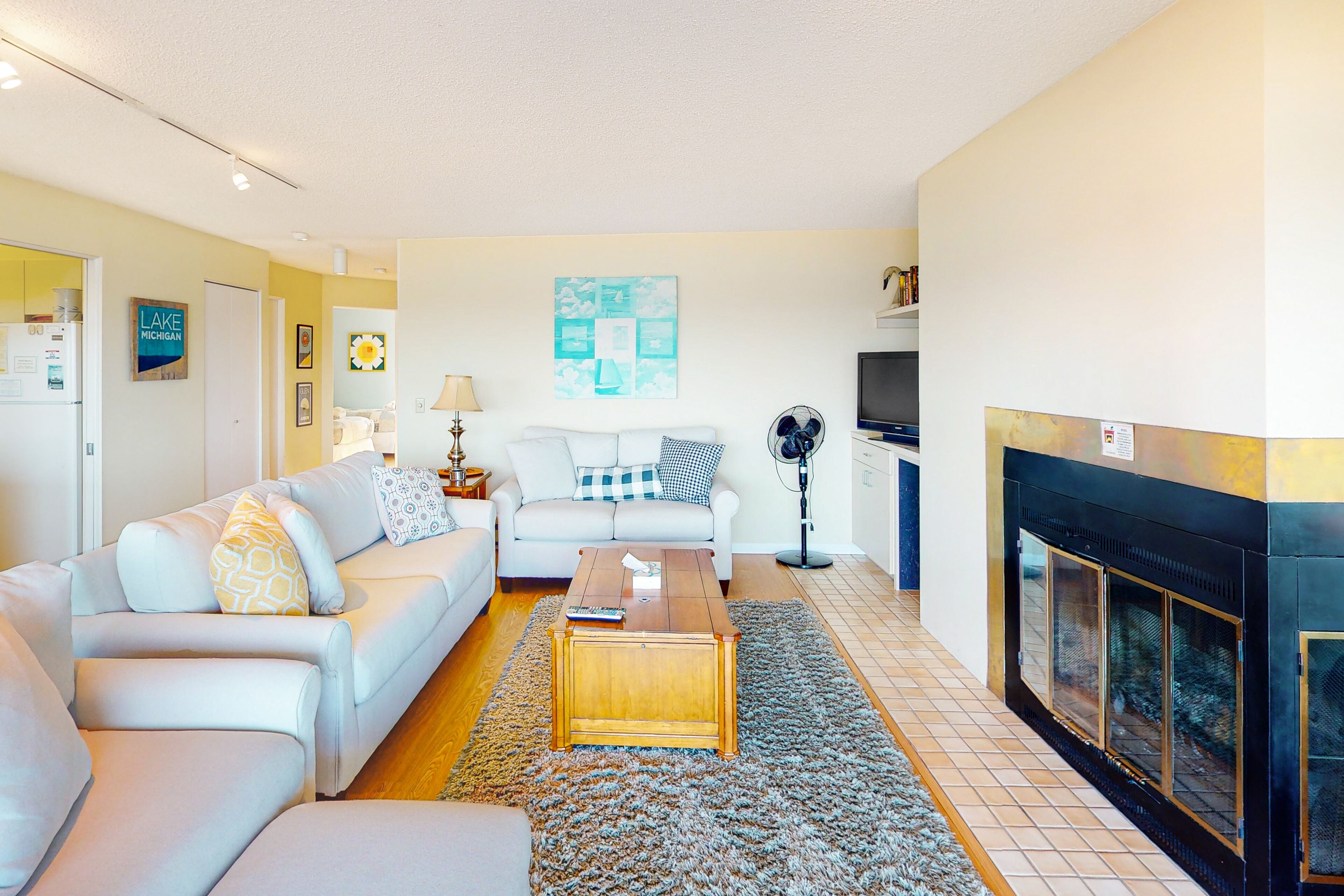 Beachfront condo with Lake Michigan views, deck, fireplace, washer/dryer, cable