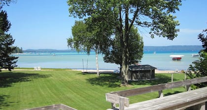 Lakefront cottage with a deck, grill, firepit, dock & partial AC