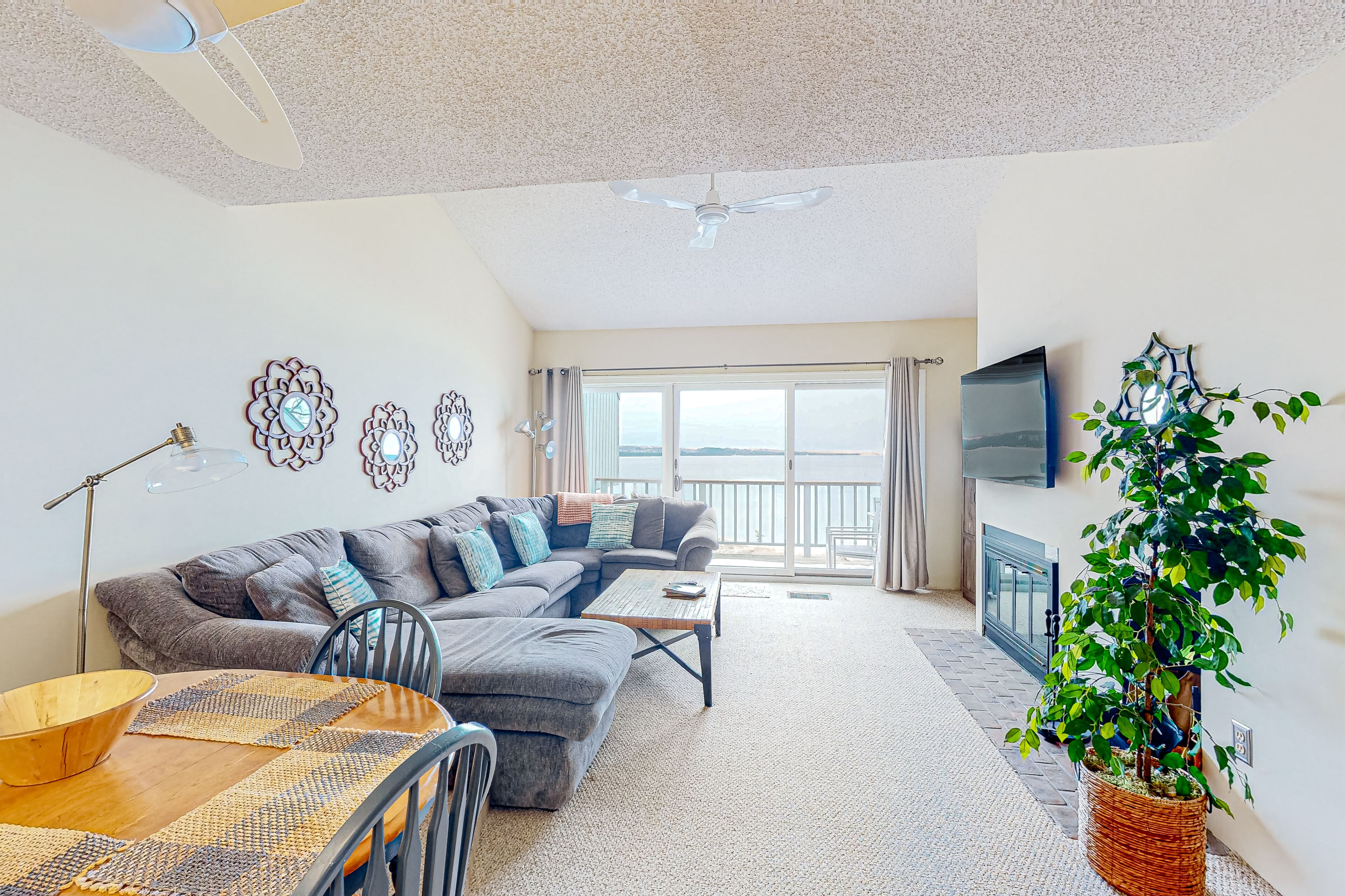 Charming and updated lake view condo with fireplace, pleasant balcony & W/D