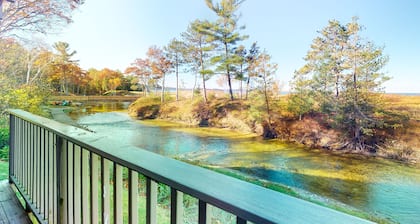 Riverfront condo with beach access to lake, fireplace, furnished deck & cable