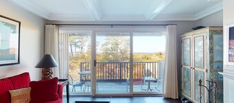 Riverfront condo with beach access to lake, fireplace, furnished deck & cable