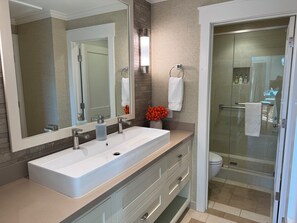 Combined shower/tub, hair dryer, towels, soap