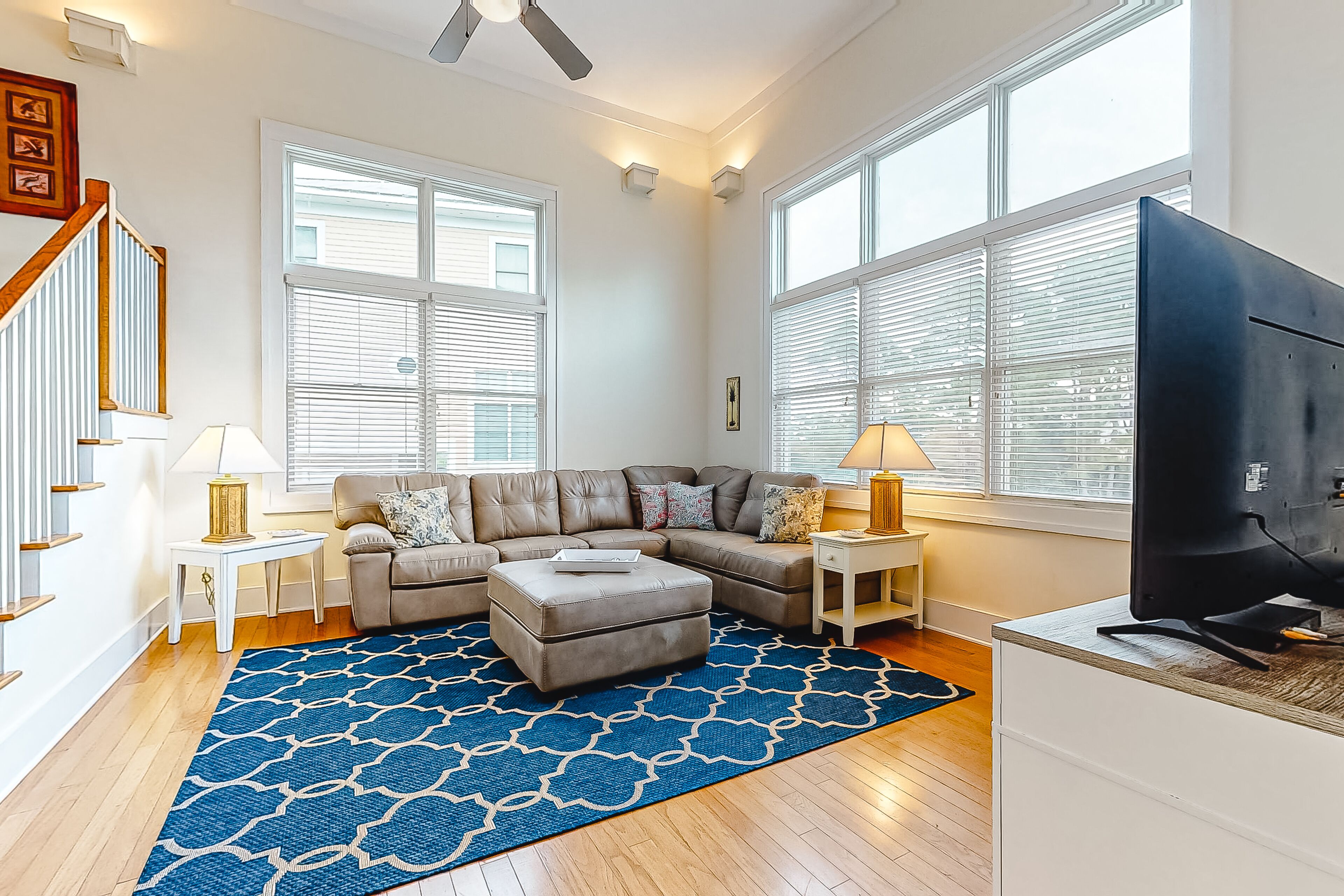 Spacious dog-friendly home with elevator, screened decks, on-site pool, & gym