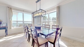 Enjoy meals in this dining room with a large table and six comfortable chairs.