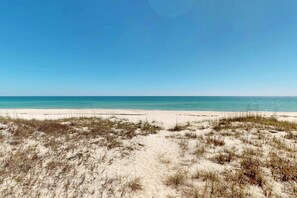 On the beach - Beachfront home with elevator, beach gear, on-site neiborhood pool, tennis & fitness room (St. George Island)