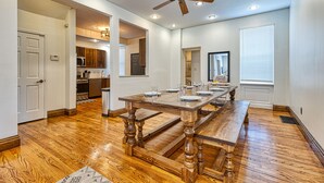 A spacious dining area with a wooden table, recessed ceiling lights, and a ceiling fan. - Huge 6Bd House Historic Updated King Bed Shaw (St. Louis)
