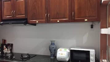 Fridge, microwave, spices, dining tables
