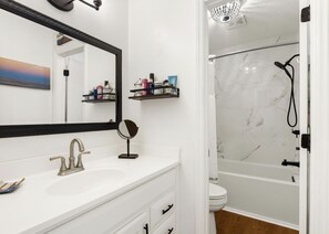 Bathtub, hair dryer, towels