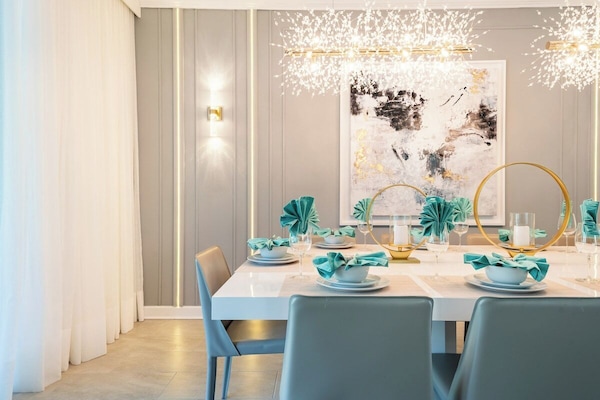 Elegant Dining with spectacular chandelier. Seats 10 comfortably.