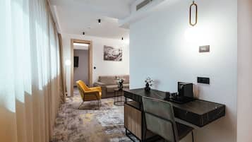 Junior Suite | Living area | 100-cm flat-screen TV with cable channels, TV