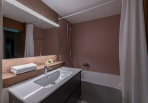 Bathtub, hair dryer, towels