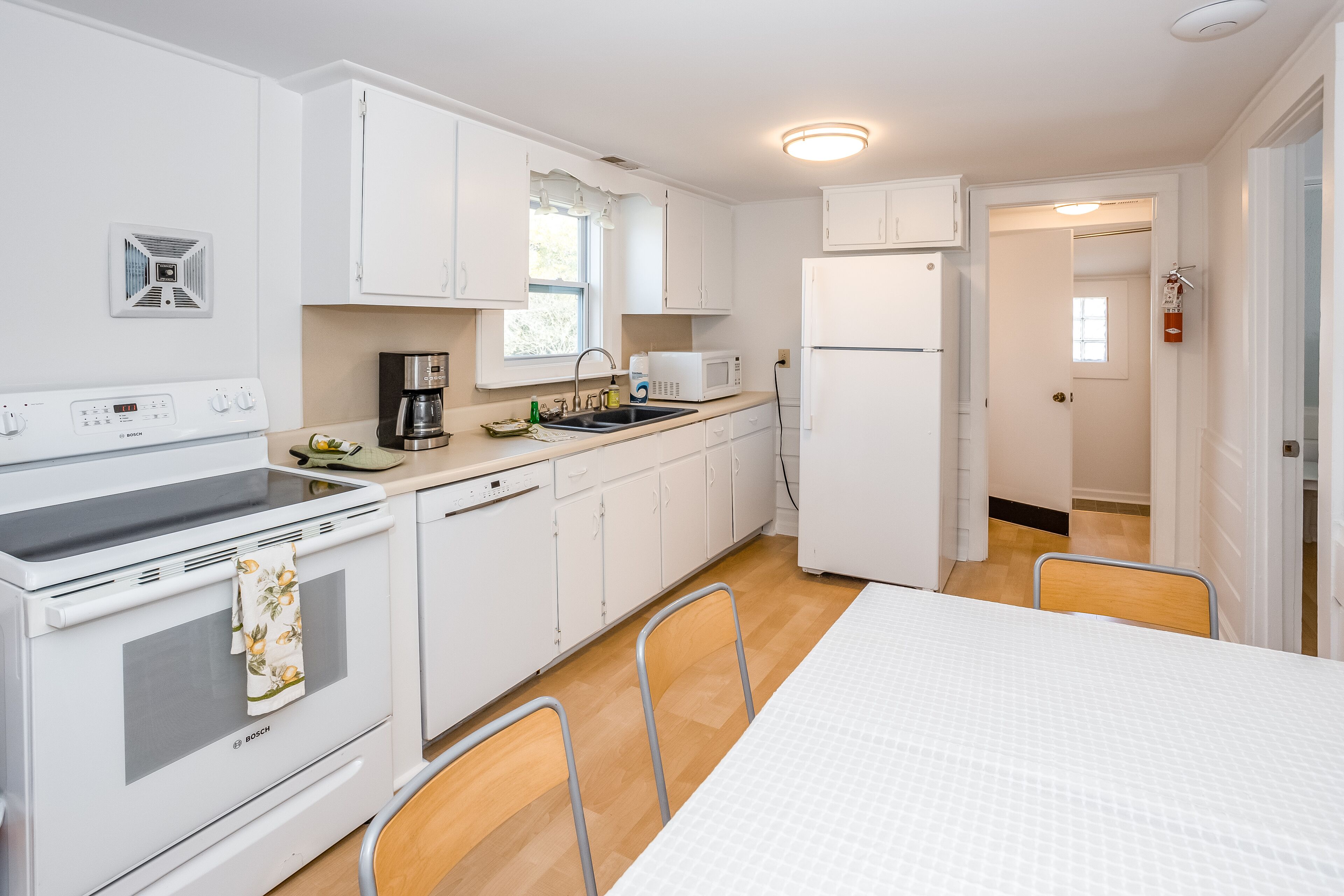 Colorful cottage steps from sand - dog-friendly, WiFi, W/D & central AC