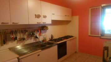 Fridge, oven, dining tables