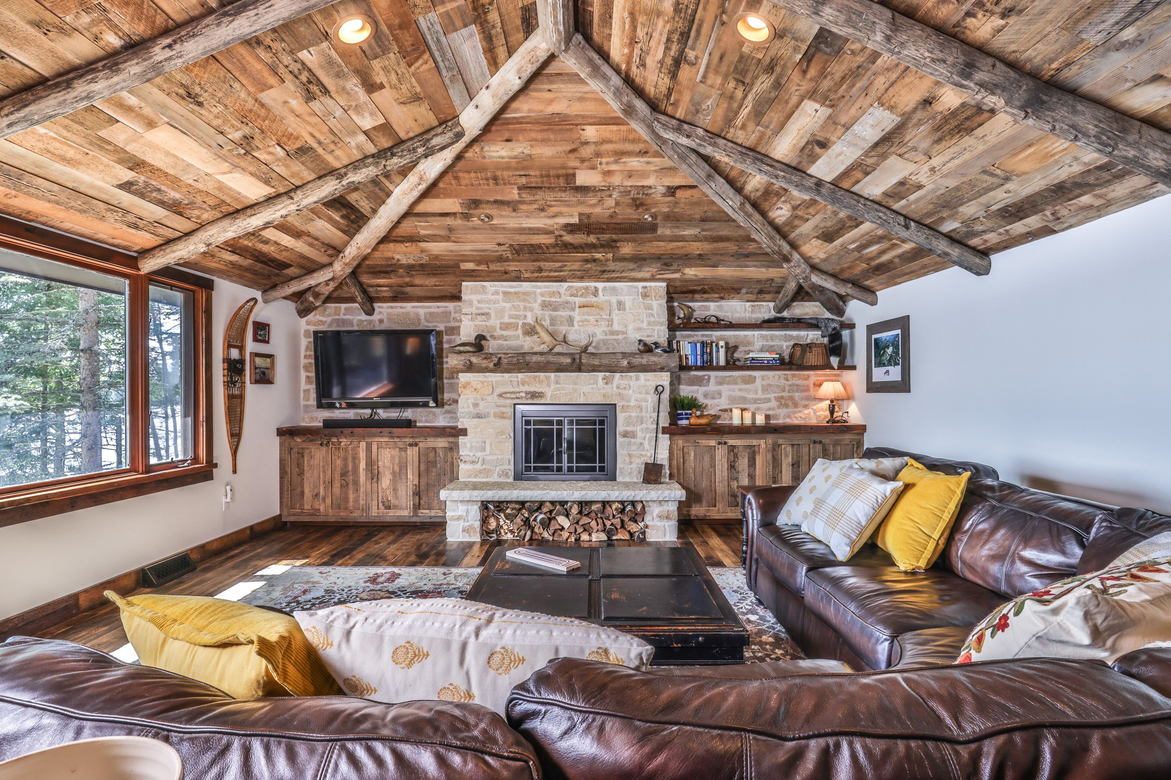 Lakefront home on snowmobile trail with kayaks/SUP, fireplace, game room & AC