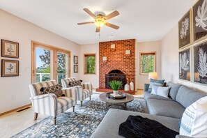 TV, fireplace, books - Newly updated home with sweeping cascade views, gas grill, WiFi & lush acreage (Camano Island)