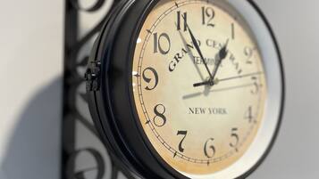 A wall-mounted clock with a classic design, featuring the brand name "Grand Central" and the location "New York."