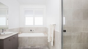 Bathtub, hair dryer, towels