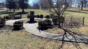 A park with a central fountain, paved pathways, and trimmed bushes. - Highland Park Place: Historic Two Bedroom Apt! (Roanoke)