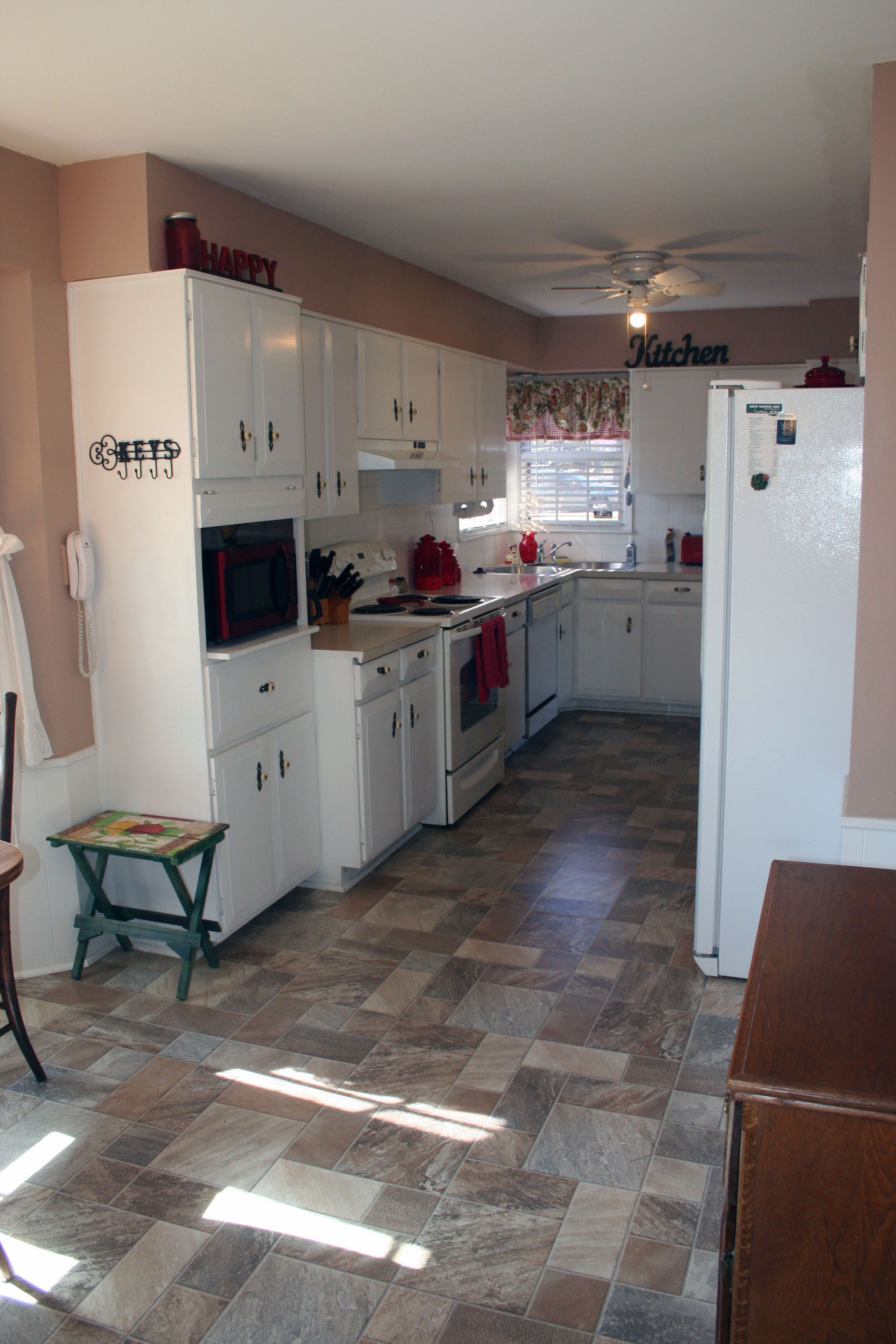 Perfectly located, east side w/fireplace, garage and fenced yard.