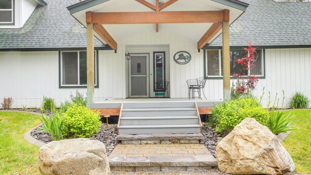 A house with a porch, stone steps, and a front door. - 10 Mi to Silverwood: Secluded Getaway! (Spirit Lake)