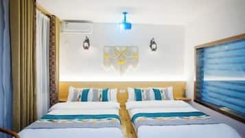 A double room with two beds, a ceiling fan, wall-mounted air conditioning, two wall sconces, and a large window with a view.