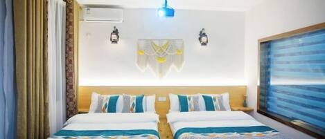 A double room with two beds, a ceiling fan, wall-mounted air conditioning, two wall sconces, and a large window with a view.