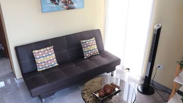 Apartment | Living area | 32-inch Smart TV with cable channels, TV, Netflix