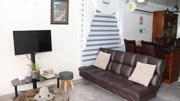 Family Apartment | Living area | 32-inch Smart TV with cable channels, TV, Netflix