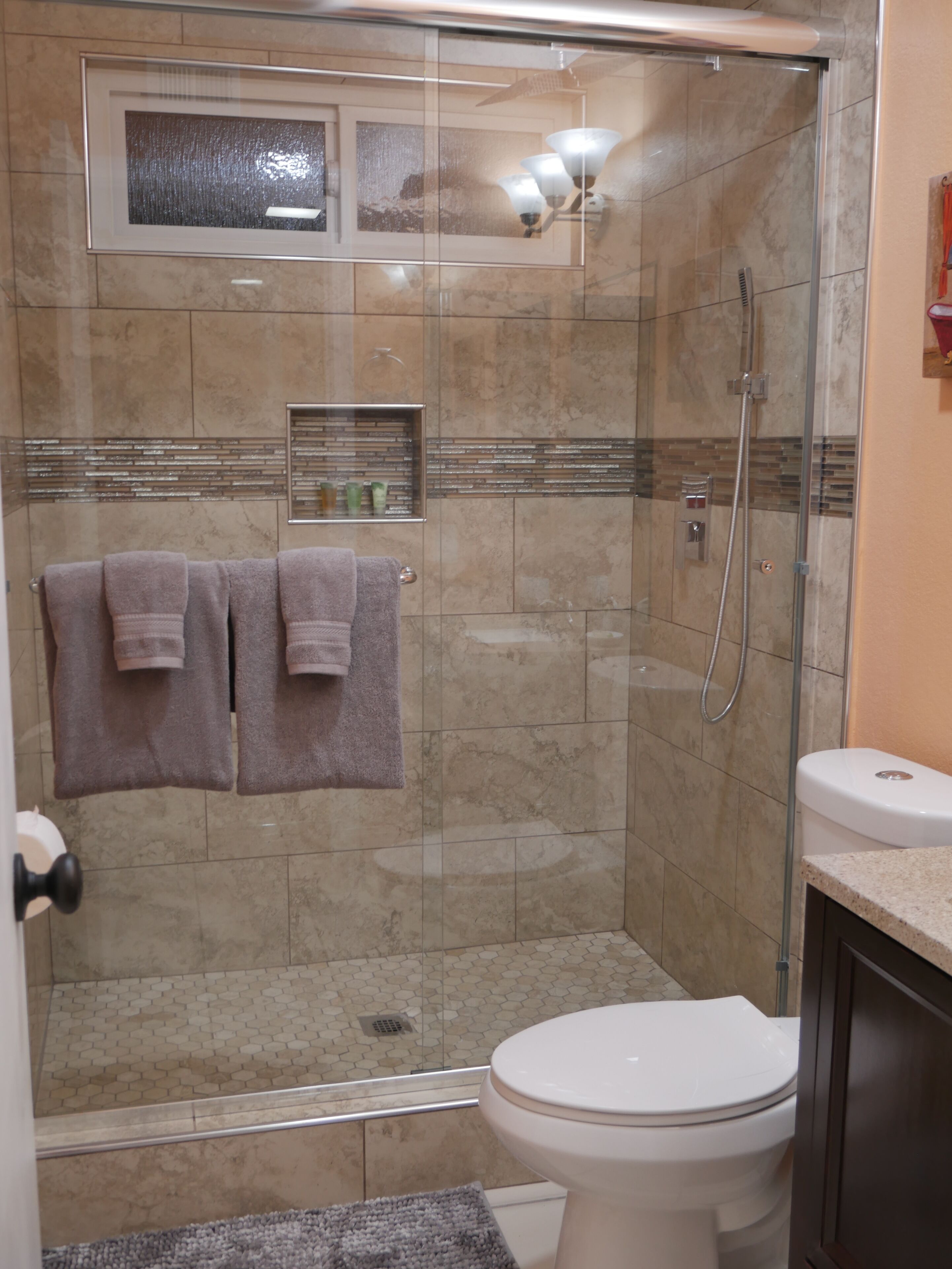 Shower, hair dryer, towels, shampoo