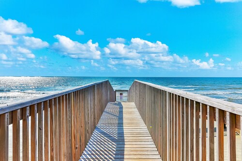 Gulf-view condo in beachfront complex with balcony, pool, hot tub, & central AC