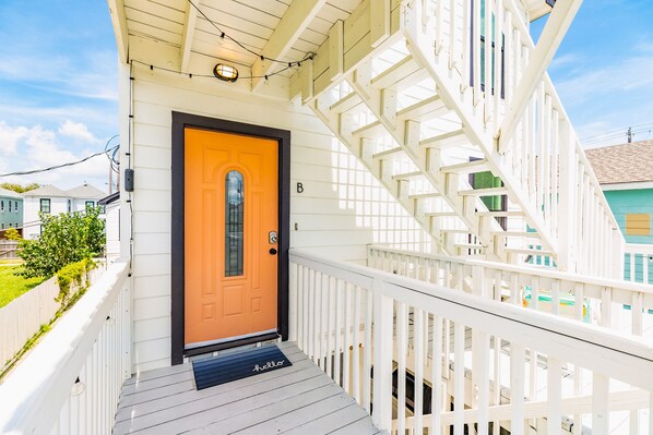 Exterior detail - Comfortable duplex with large 2nd floor deck, W/D, central AC-1 block from beach (Galveston)