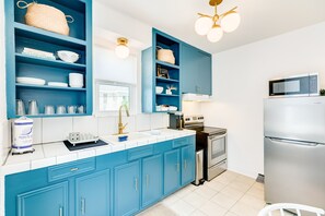 Fridge, microwave, oven, stovetop - Modern dog-friendly duplex, 1 block from beach with shared backyard patio & W/D (Galveston)
