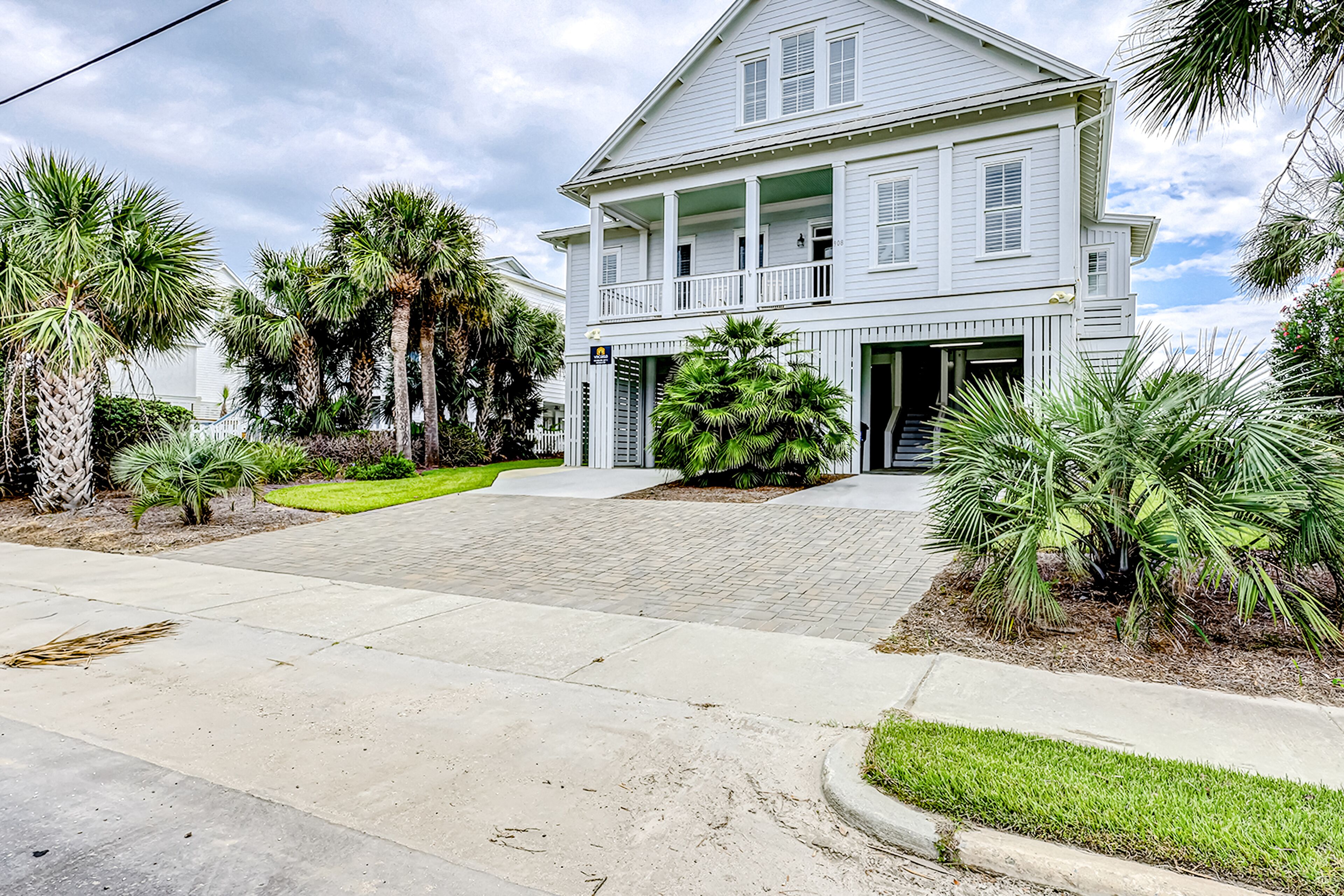Luxe oceanfront home with dazzling beach views, screened porch & elevator