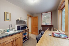 Fridge, microwave, coffee/tea maker, cookware/dishes/utensils