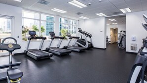 A gym with treadmills, a stationary bike, and a rowing machine. - TC-3406 · Lovely 2BR Rental in the Heart of Brickell (Miami)