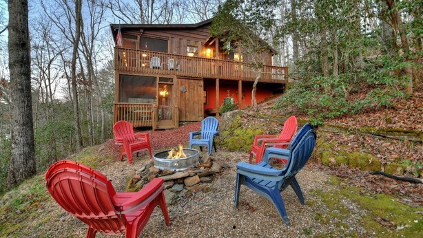 A cabin with a deck, outdoor seating, and a fire pit. - Cozy Charm with a Fireplace Feature - American Dream (Blue Ridge)