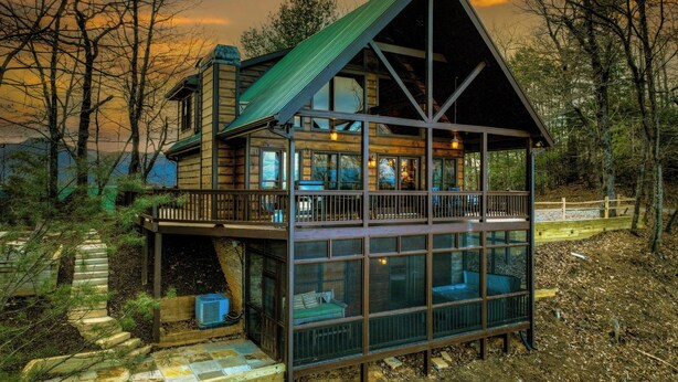 A two-story wooden cabin with a balcony and large windows. - Nearby hikes + a hot tub! - Appalachian Sunrise (Blue Ridge)