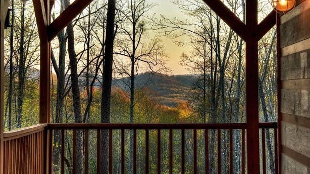 A wooden deck with a view of a forested landscape. - Scenic Views, Hot Tub Soaks, Firepit Roasts, Cookouts & Nearby Adventures - Cardinal's Crossing (Morganton)