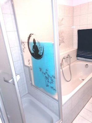 Bathtub, hair dryer, towels, soap