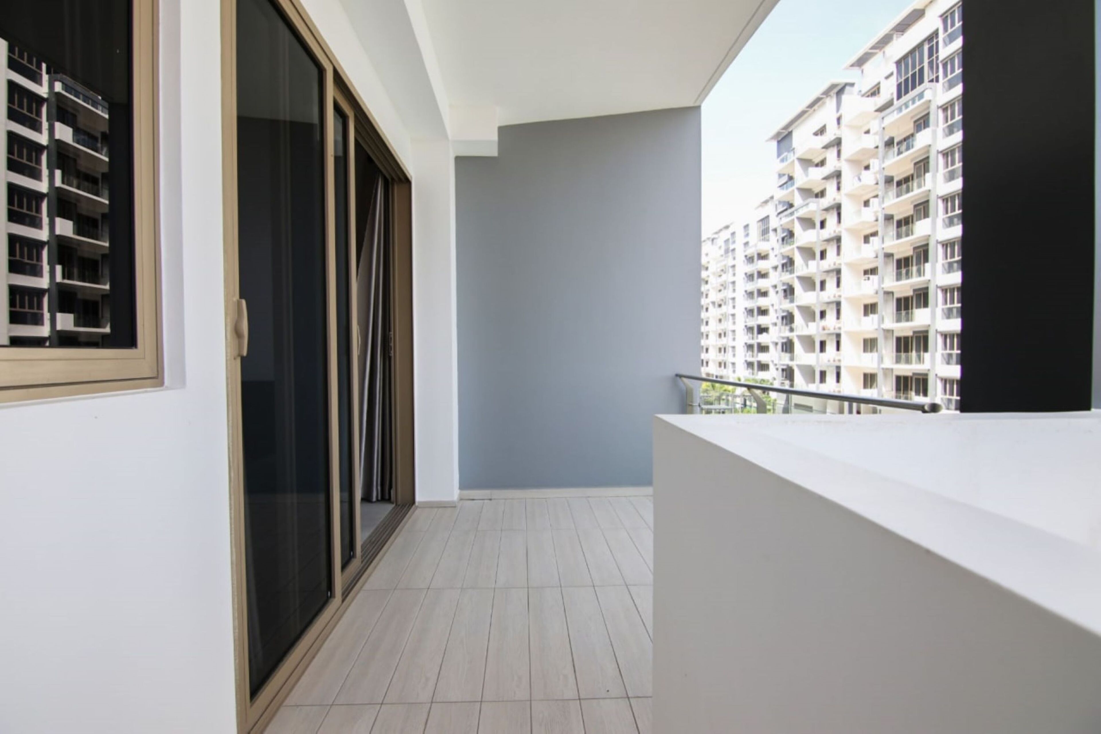 A balcony with a view of high-rise buildings.