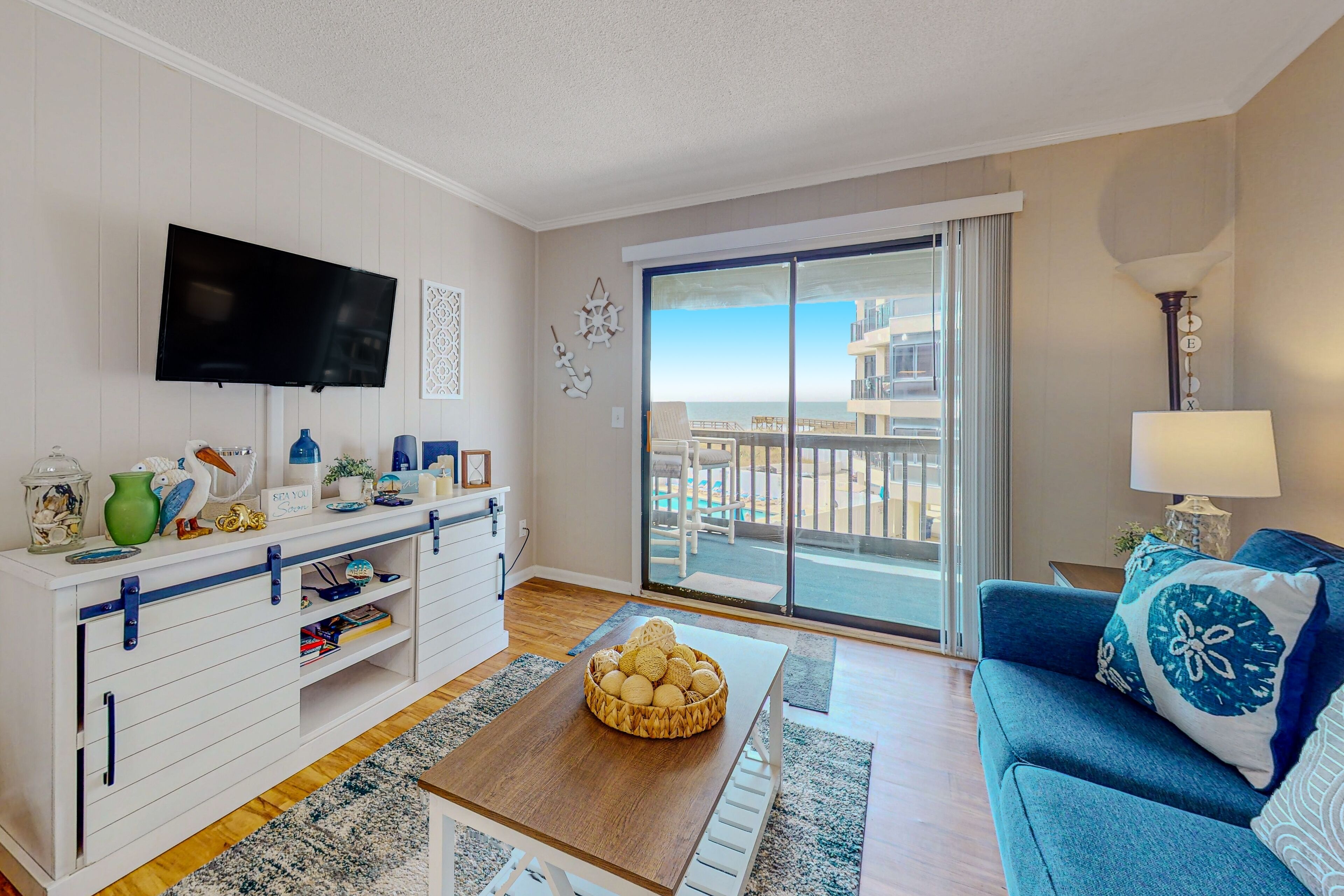 Second-floor oceanfront condo with a balcony, views, central AC, & pool