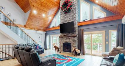 Luxurious waterfront home with deck, firepit, hot tub, fireplace, & pool table